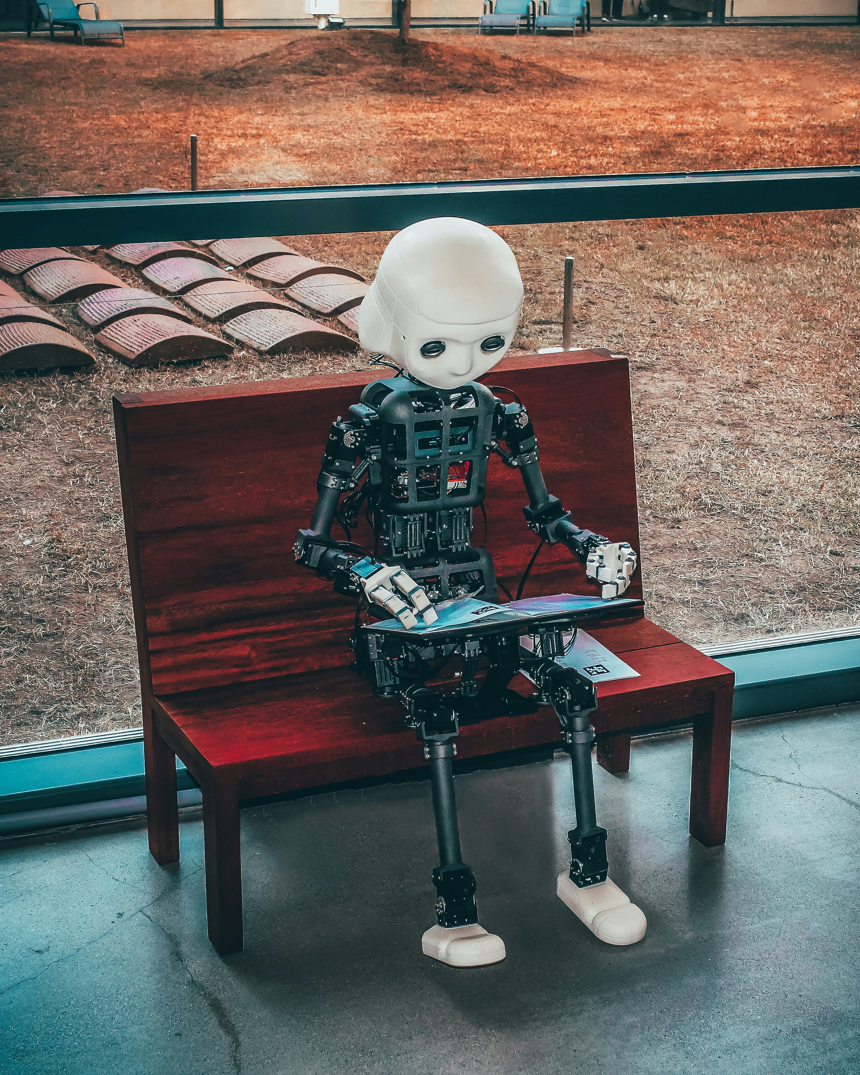 AI robot on a wooden bench